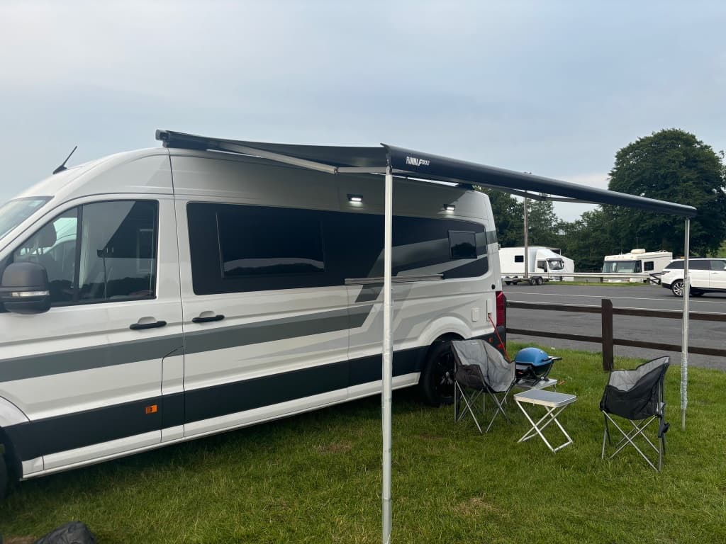Scottish Highlands - Luxury camper with Highland backdrop